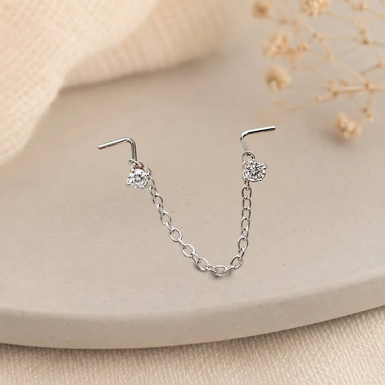 double-stud-chain-nose-piercing.jpg
