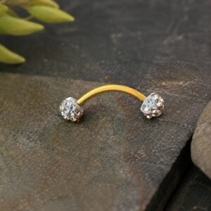 curved-gold-eyebrow-piercing-closeup.jpg