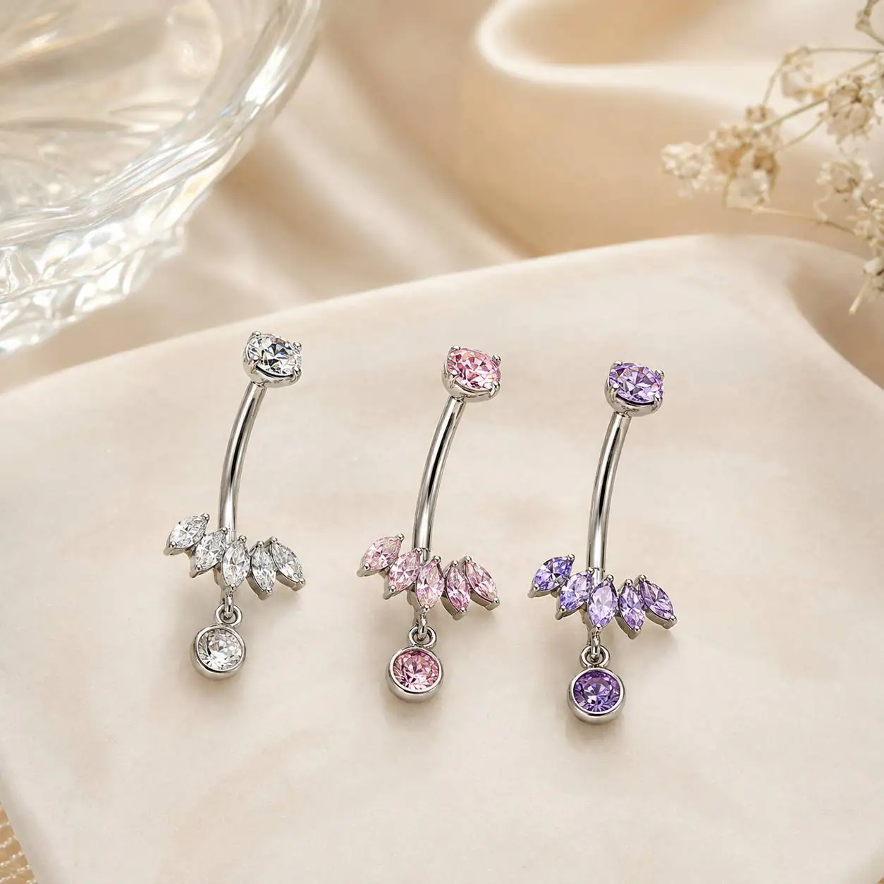 leaf-titanium-belly-ring-clear پیرسینگ ناف تیتانیومی طرح برگ با نگین سفید و آویز گرد