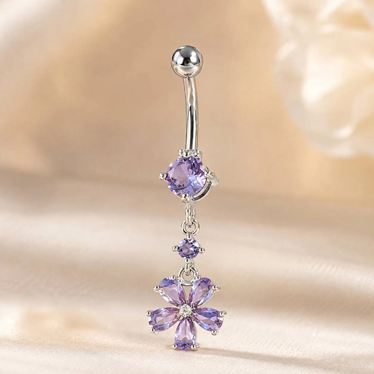 purple-flower-belly-piercing-front-view.jpg پیرسینگ ناف آویز گل با نگینهای بنفش و بدنه نقرهای