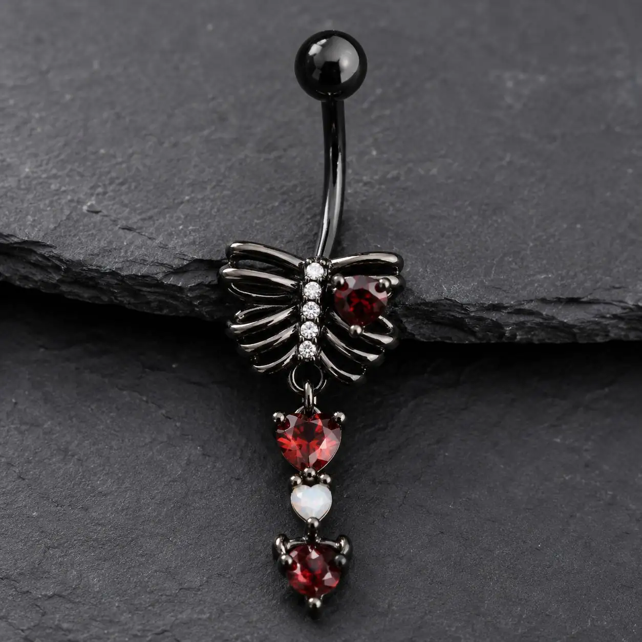 rib-cage-heart-navel-piercing-front.jpg پیرسینگ ناف طرح قفسه سینه و قلب با نگینهای قرمز