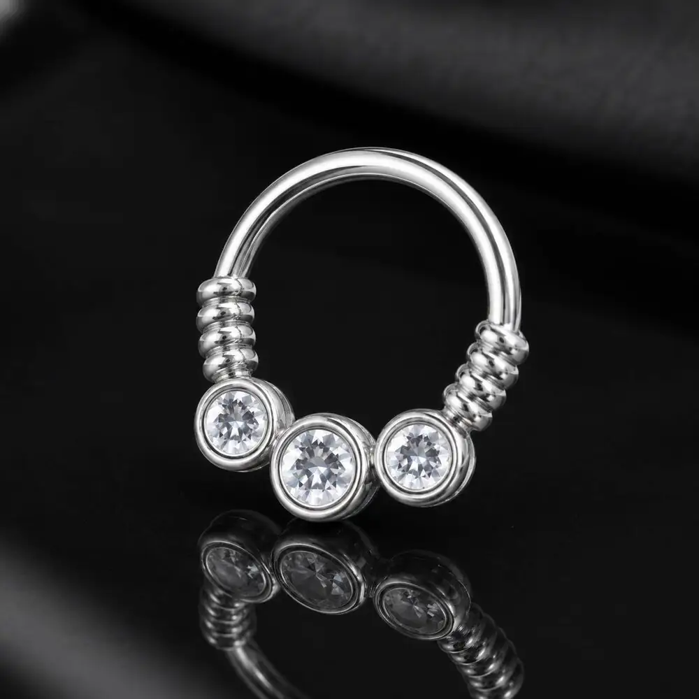 silver-three-stone-septum-ring-black-background