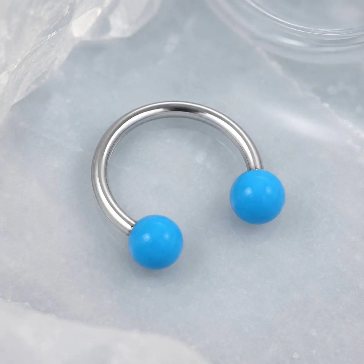 blue-horseshoe-piercing-top-view