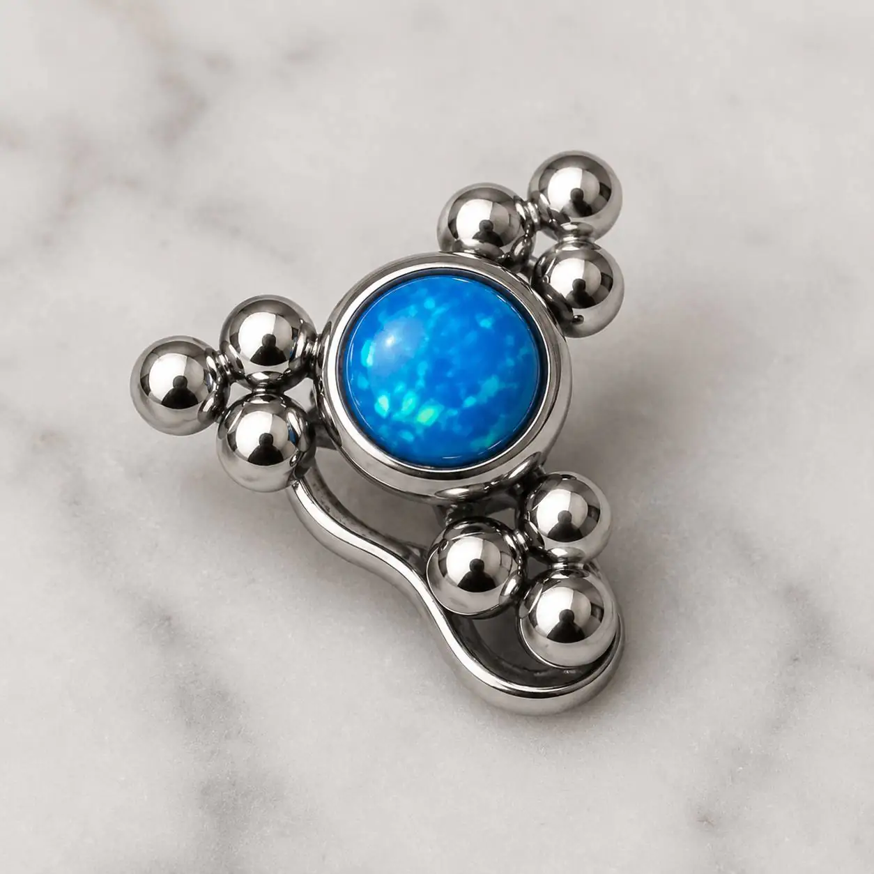 blue-opal-cluster-dermal-jewelry پیرسینگ میکرودرمال نقرهای با نگین اوپال آبی و فرم منحنی تزئینی