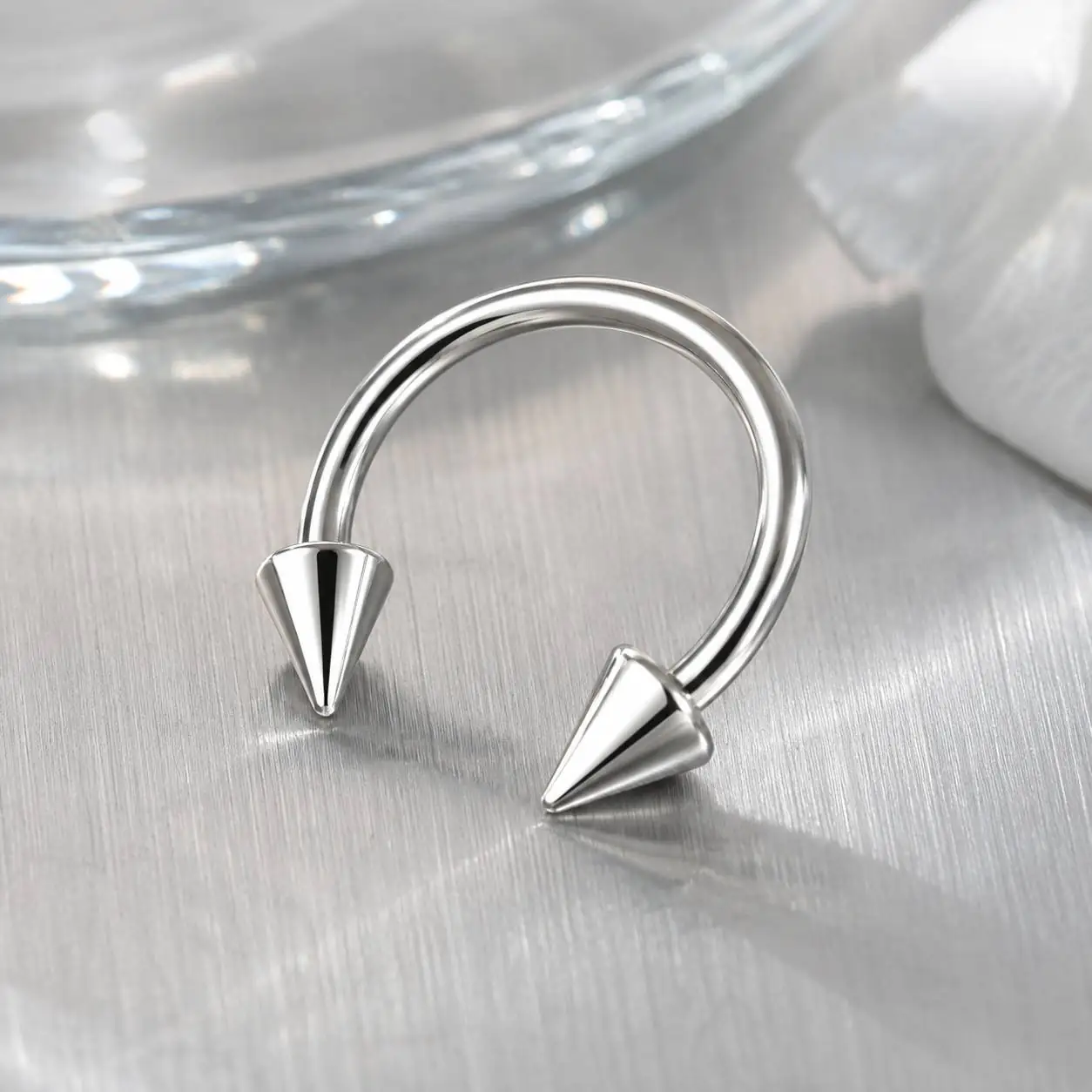 horseshoe-smiley-piercing-metal-surface