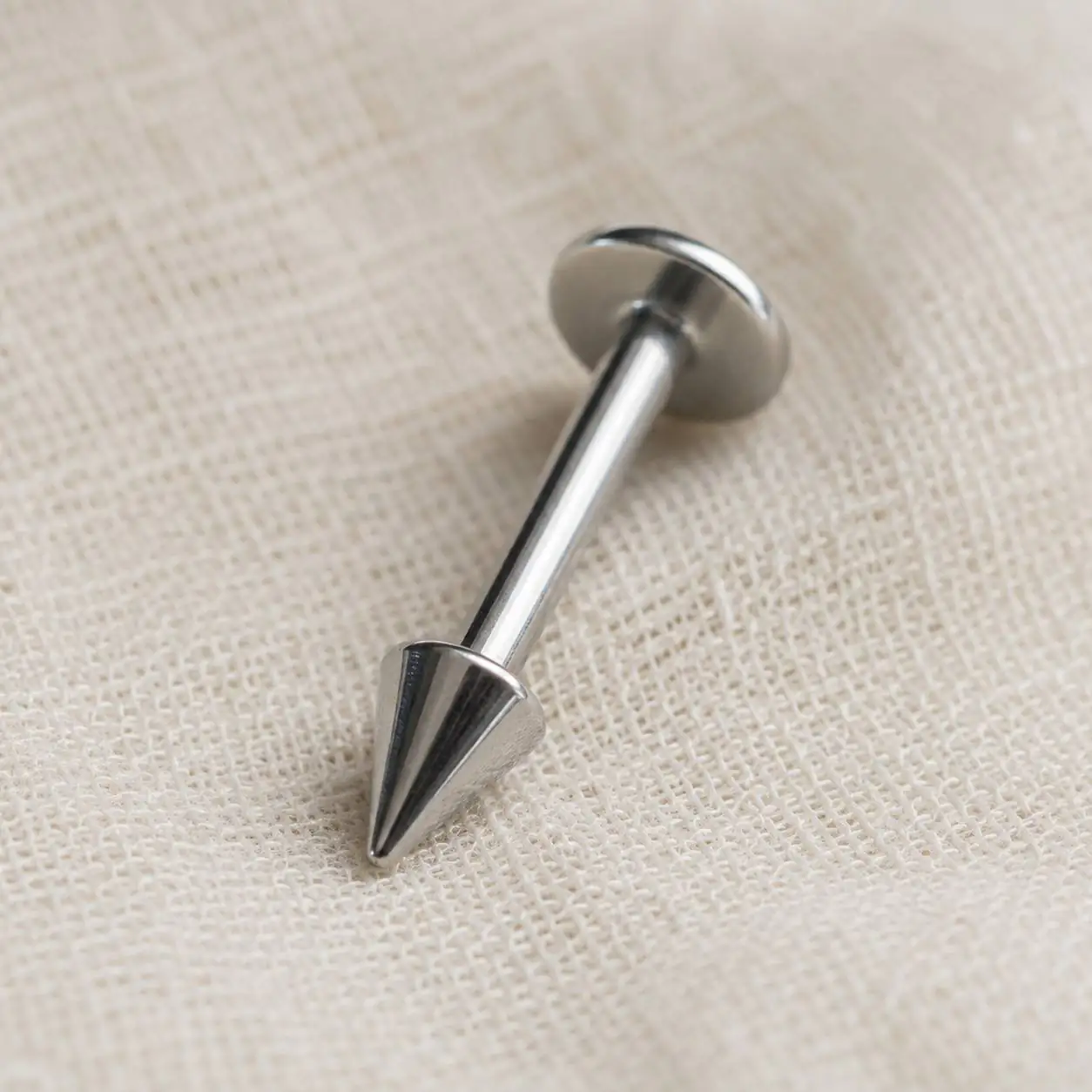 silver-cone-lip-piercing-macro-detail