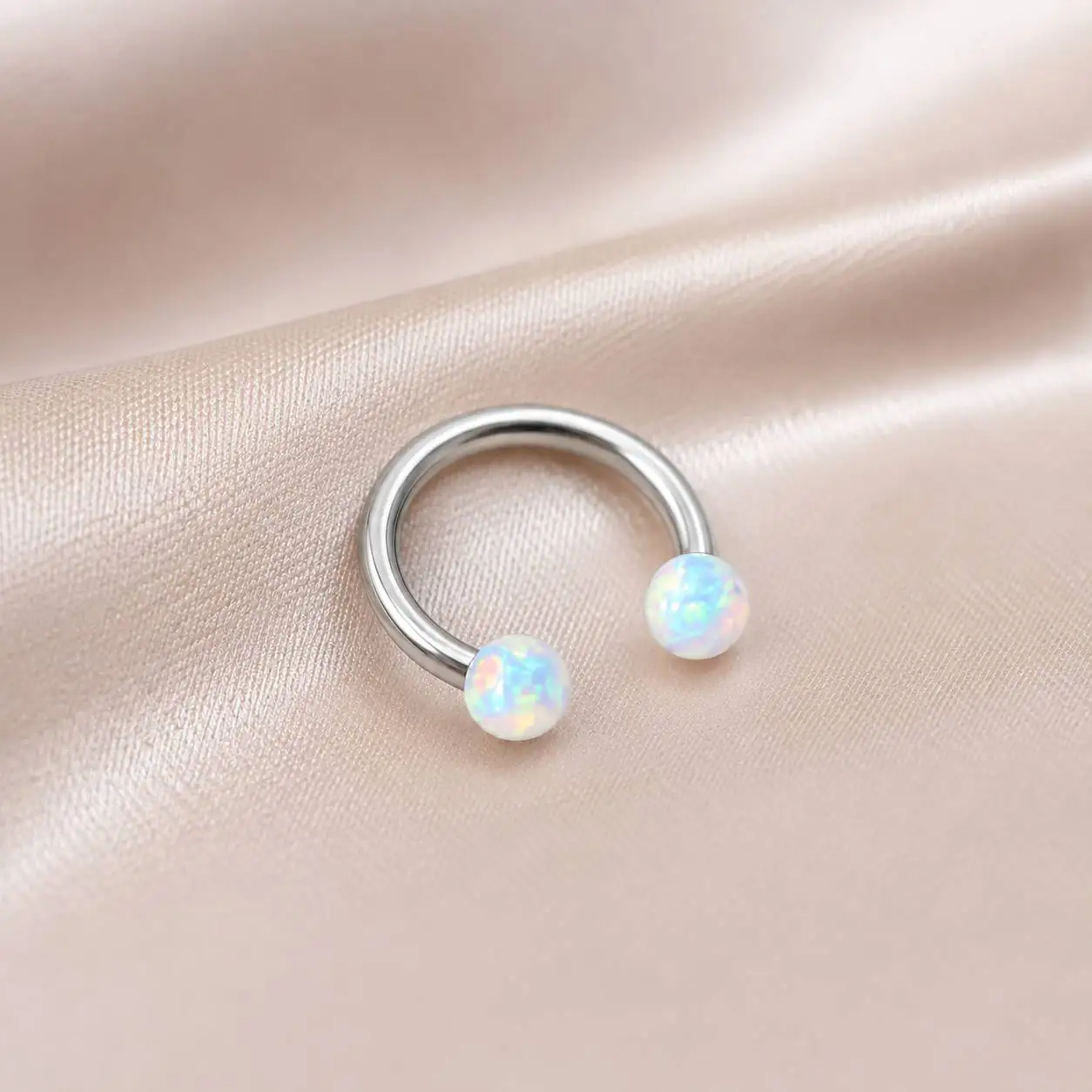 silver-opal-smiley-piercing-satin-background