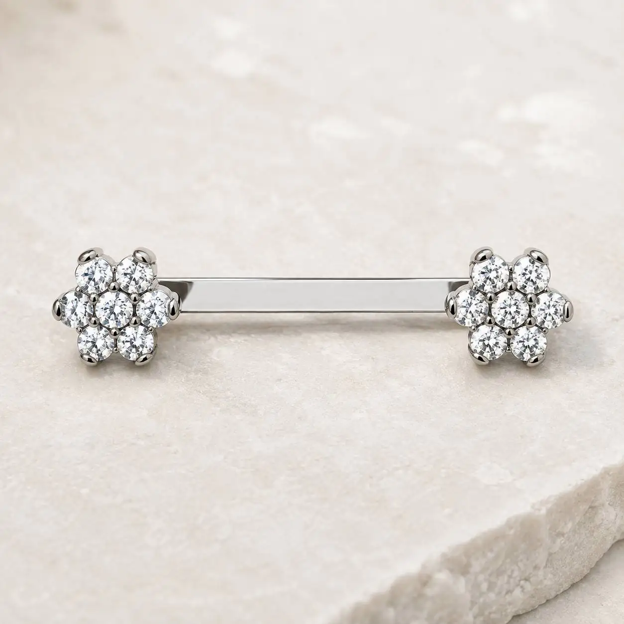 titanium-clavicle-surface-piercing-flower-design پیرسینگ سارفیس ترقوه تیتانیومی طرح گل با نگینهای شفاف