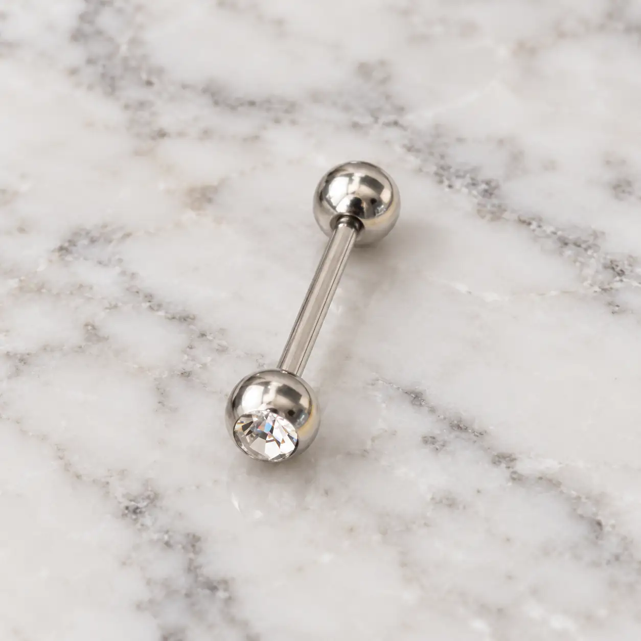 clear-gem-silver-barbell-piercing.web