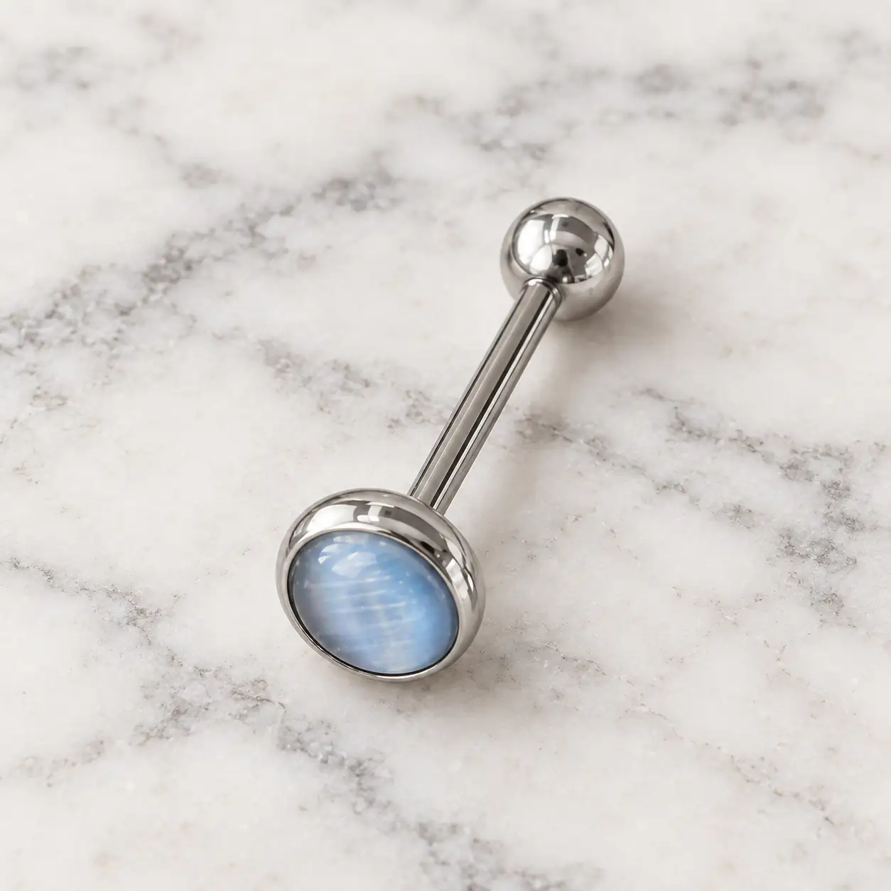 silver-barbell-blue-gem-piercing-wide.webp